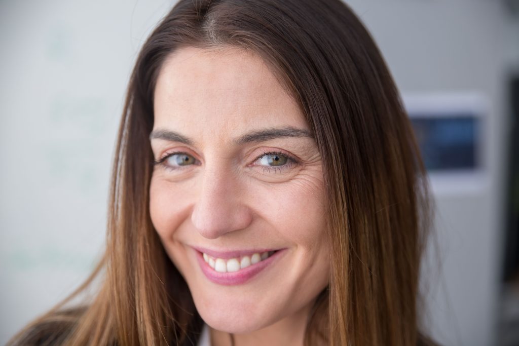 Use a bright, close-up lifestyle image of a healthy adult smile.