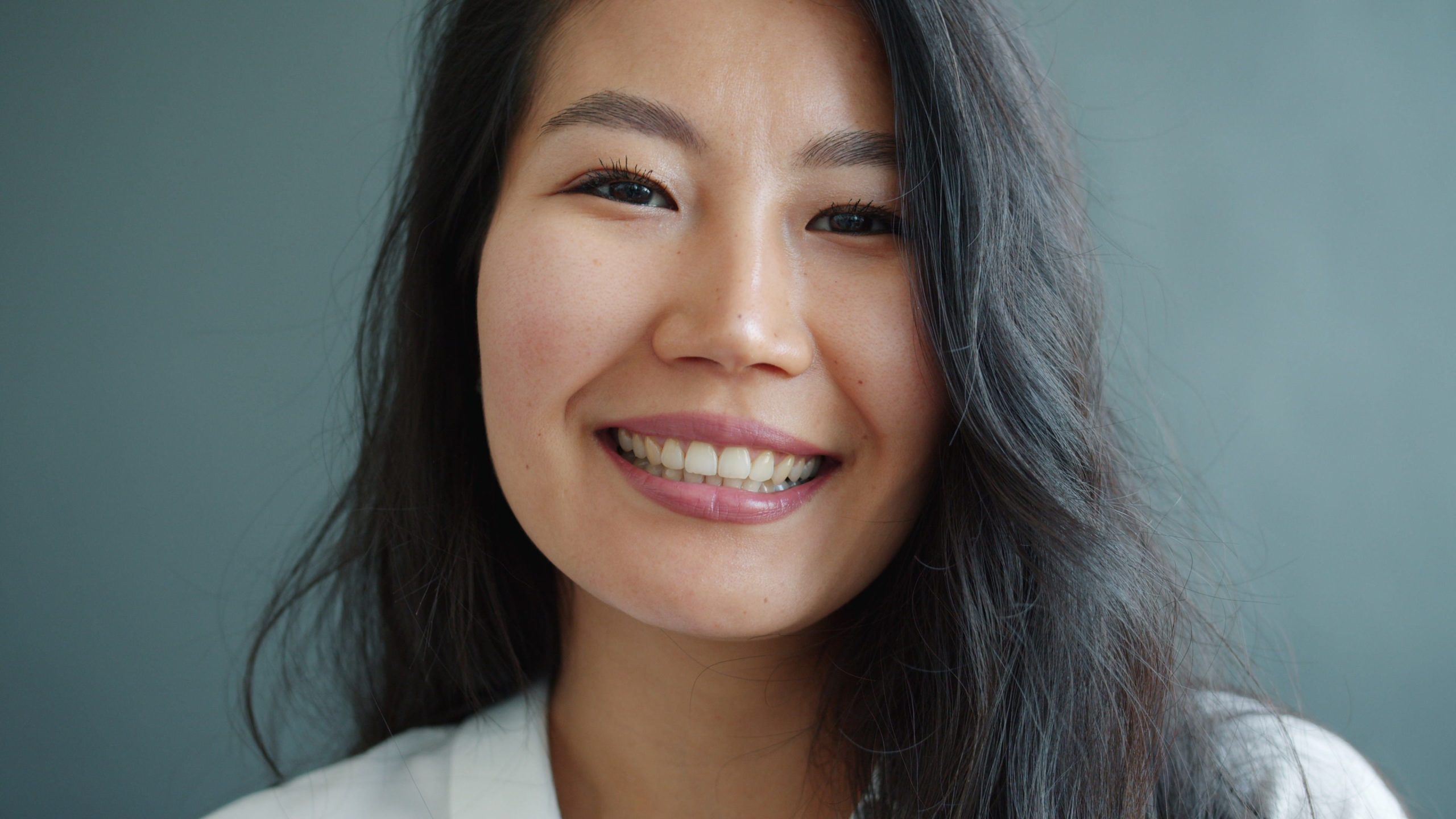 Patient smiling after crowns and bridges treatment